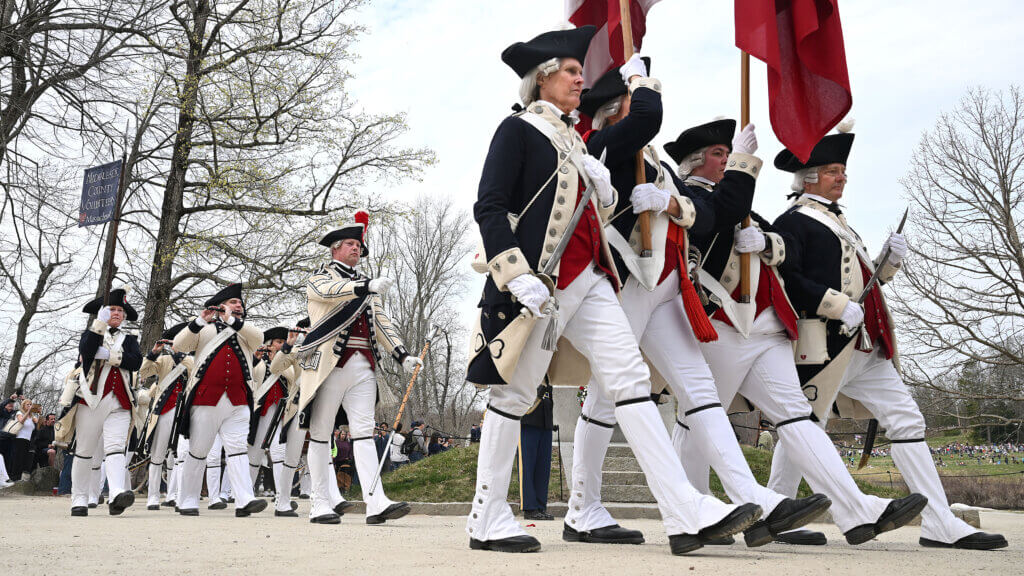 The Middlesex County Volunteers march at the conclusion of the North Bridge ceremony and beginning of the Patriots Day parade, April 19, 2025. Ken McGagh/The Acton Bridge