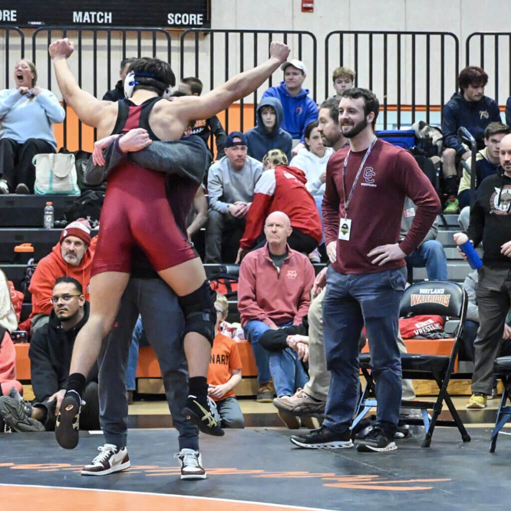 Kyle Amouzgar is congratulated by Head Coach Peter Charnley and Assistant Coach Rick Fadden (right). Photo by Kim Amouzgar