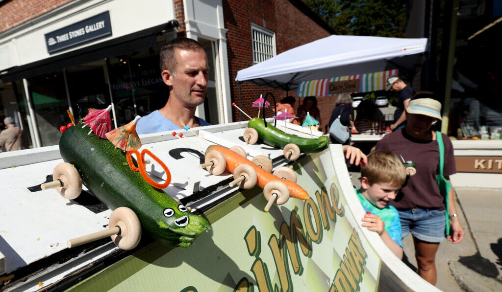 Children and adults launch racers made from vegetables on the Scimone Farm Speedway sponsored by Vanderhoof Hardware.
