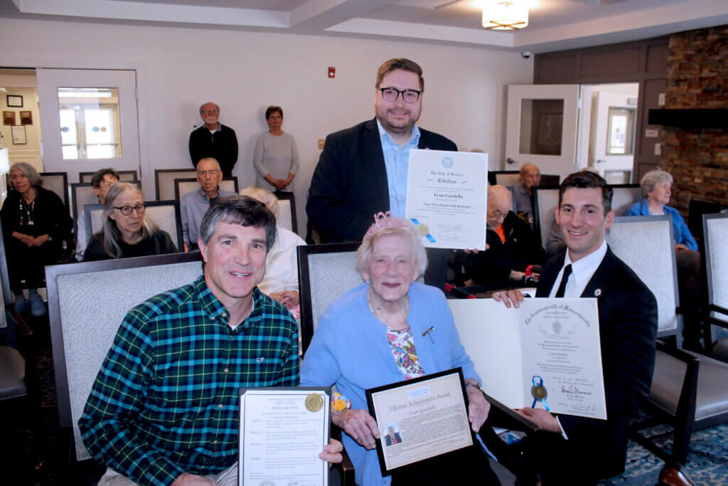 Select Board member Cameron McKennitt, state Rep. Jon Zlotnic, and state Rep. Simon Cataldo, and present Gardella with citations. She was McKennitt’s kindergarten teacher. Photo by Dorie Mansen
