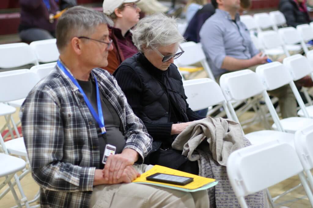 Merill Comeau embroiders her father's memoir during the hourslong proceedings. Photo: Trace Salzbrenner/The Acton Bridge