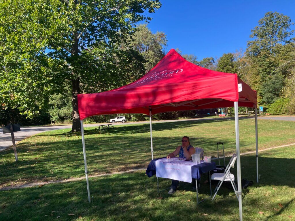 Tourism Manager Beth Williams sits ready to welcome tourists at a pop-up "visitor center" at Minute Man. Photo: Dakota Antelman/The Acton Bridge
