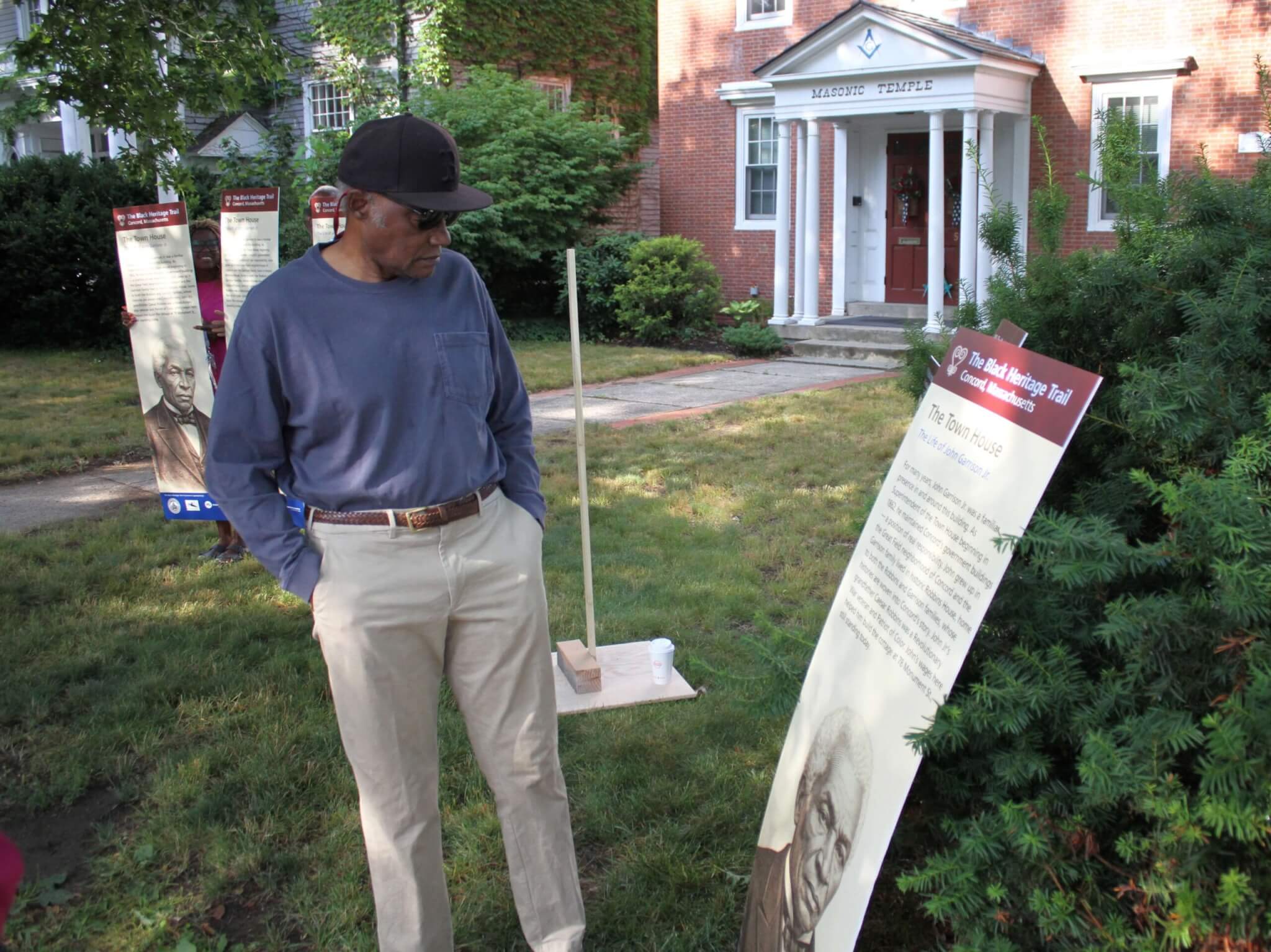 Robbins House interpreter Joe Zellner examines a proposed Black Heritage Trail Marker sign. Photo: Dakota Antelman/The Acton Bridge