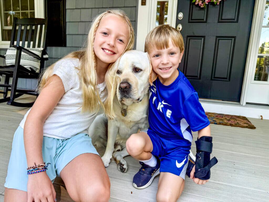 Harper Strange, 9, and Max Strange, 6, are both students at Alcott Elementary School. Pup Maverick, 4, studies at home.
