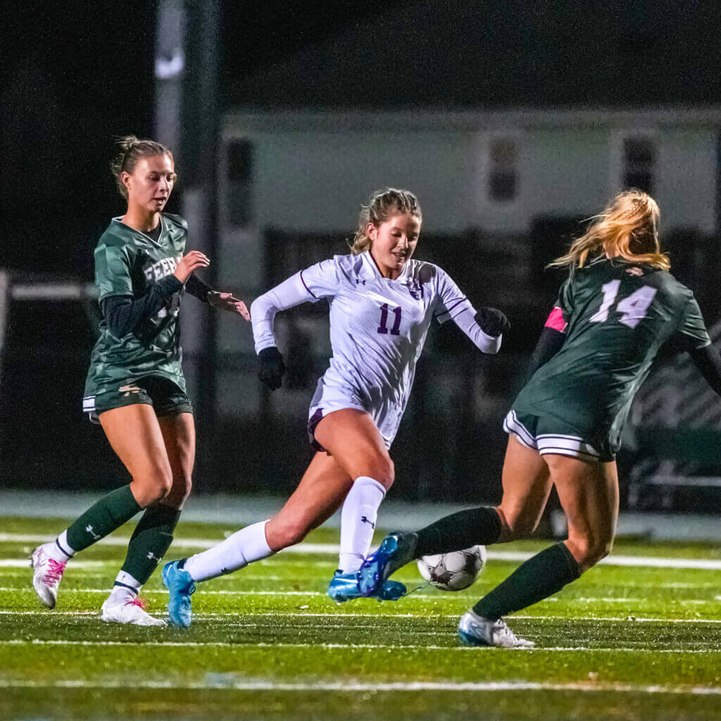 Emmy O'Donnell (No. 11) charges upfield. Photo by Aidan Moroney