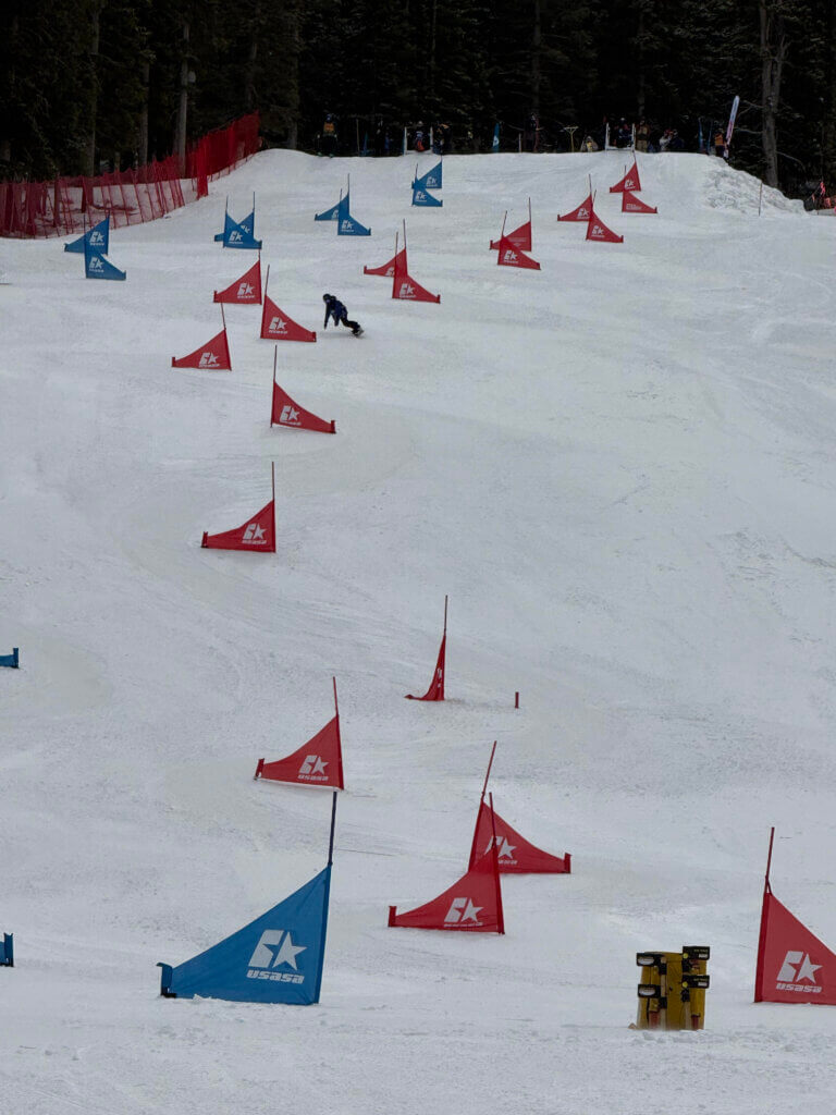 Brady, 11, running the slalom course at USASA Snowboard National Championships. Photo by Laura Bulino