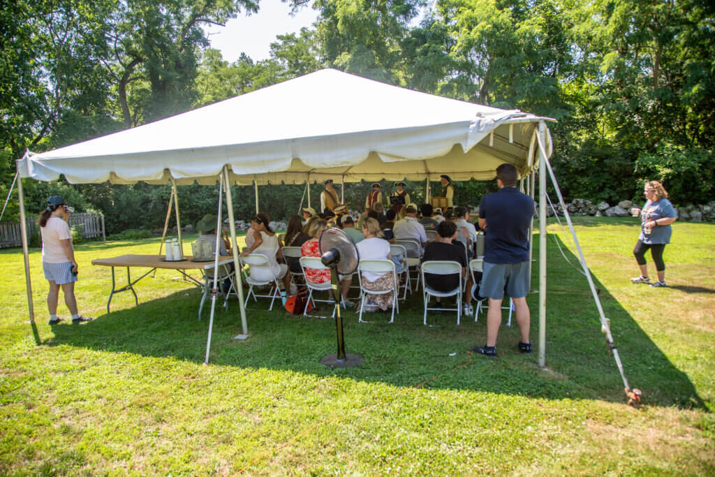 Shade, hydration, and air circulation helped with the day’s oppressive heat.
