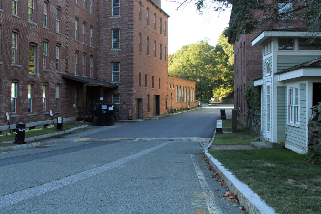 Unlike Estabrook Trail, Pond Lane is a driveway for the busy Damonmill Square complex. Photo: Dakota Antelman/The Acton Bridge