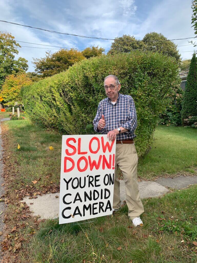 Dave Schaefer stands next to the sign he put in his yard on Upland Road. Courtesy photo