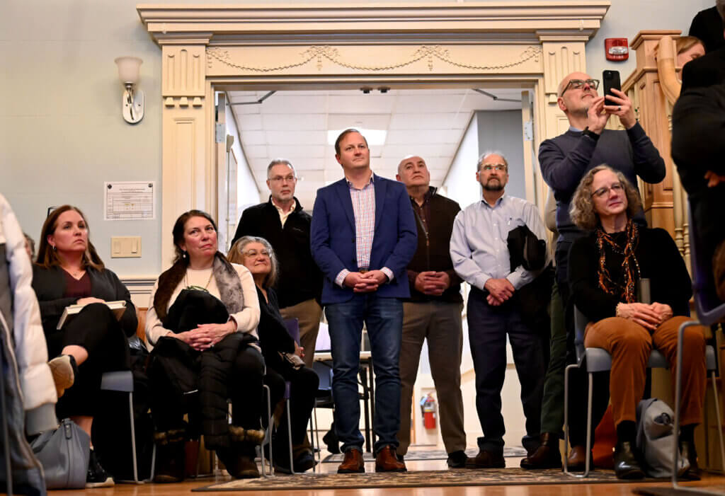 Standing room only in the rear of the Town House second floor Hearing Room for the Town Caucus on Monday, January 27, 2025. Ken McGagh/The Acton Bridge