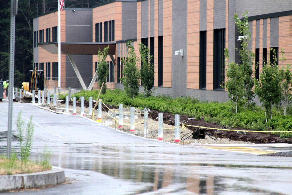 Demolition of a damaged walkway left crumpled concrete outside the Ellen Garrison Building at Acton Middle School in late July. Photo: Dakota Antelman/The Acton Bridge