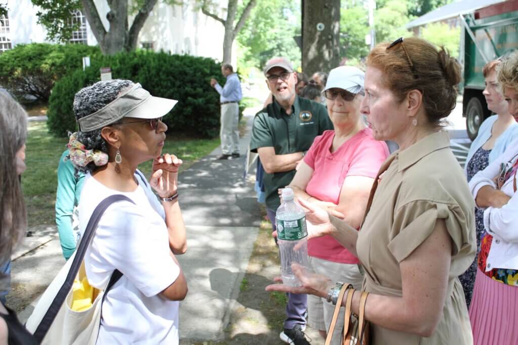Robbins House co-founder Maria Madison, left, speaks with Historic Districts Commission Chair Kate Chartener. Photo: Dakota Antelman/The Acton Bridge