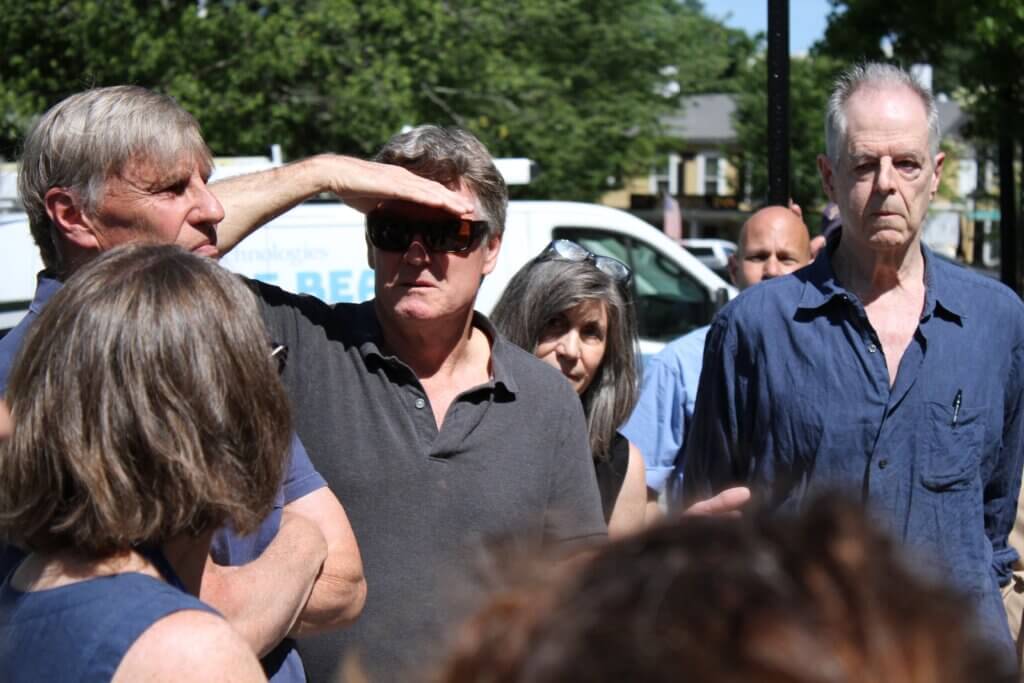 Historic Districts Commission members listen to Economic Vitality Coordinator Mimi Graney, left, during a site visit. Photo: Dakota Antelman/The Acton Bridge
