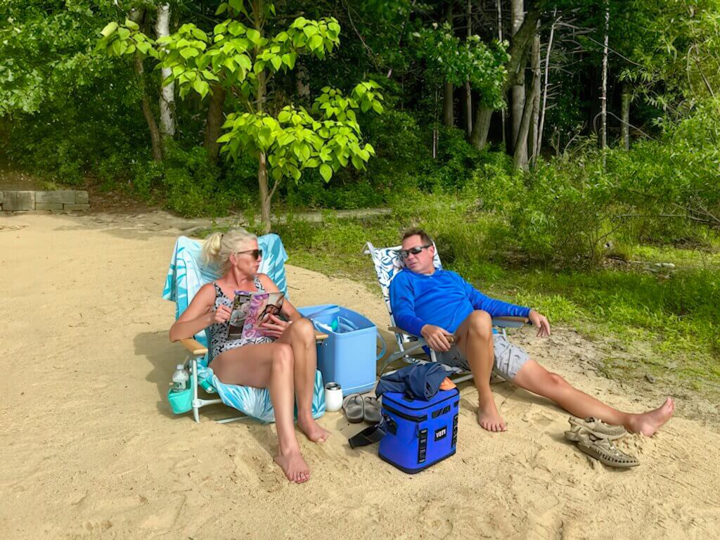 Susan and Tom Doering enjoy a tranquil afternoon on the pond’s shore. Photo by Elisabeth Weber