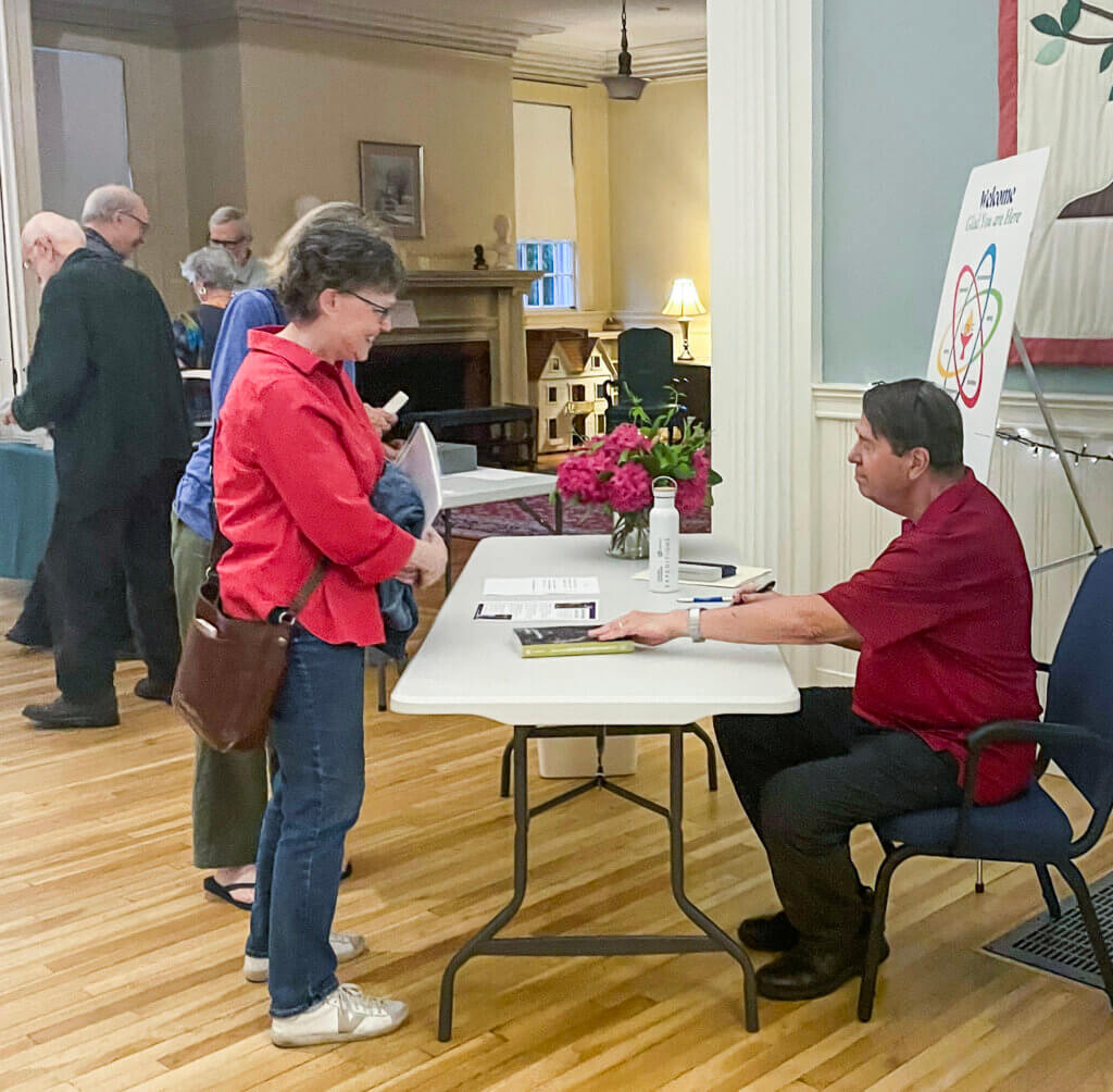 The theologian signs copies of his work. Photo by Fiona Stevenson