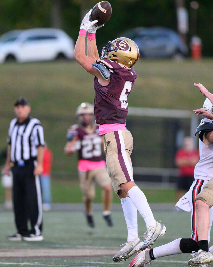 CCHS captain Aiden Bayes intercepts a pass before returning it 48 yards for a touchdown late in the second quarter of the Patriots’ 16-7 win over Holliston on September 18. Photo by Jon Straggas
