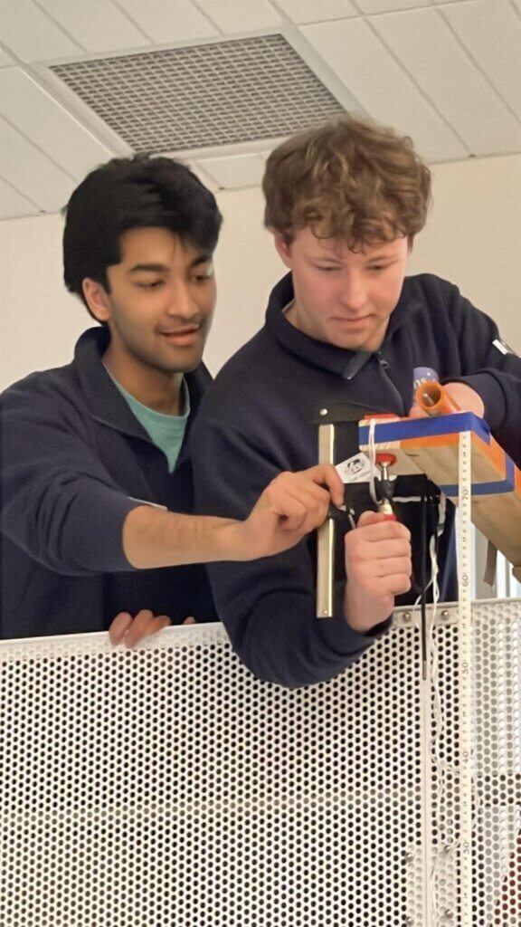 Acton-Carlisle seniors Shaunit Bajoria and Noah Arthur compete in the bungee drop physics build event at the 2026 Massachusetts State Science Olympiad. Photo by Evan Wang