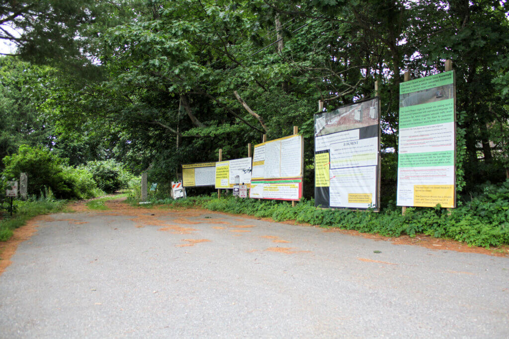 Estabrook defendant Brooks Read has built a series of billboards chronicling his legal fight with the town. Photo: Dakota Antelman/The Acton Bridge