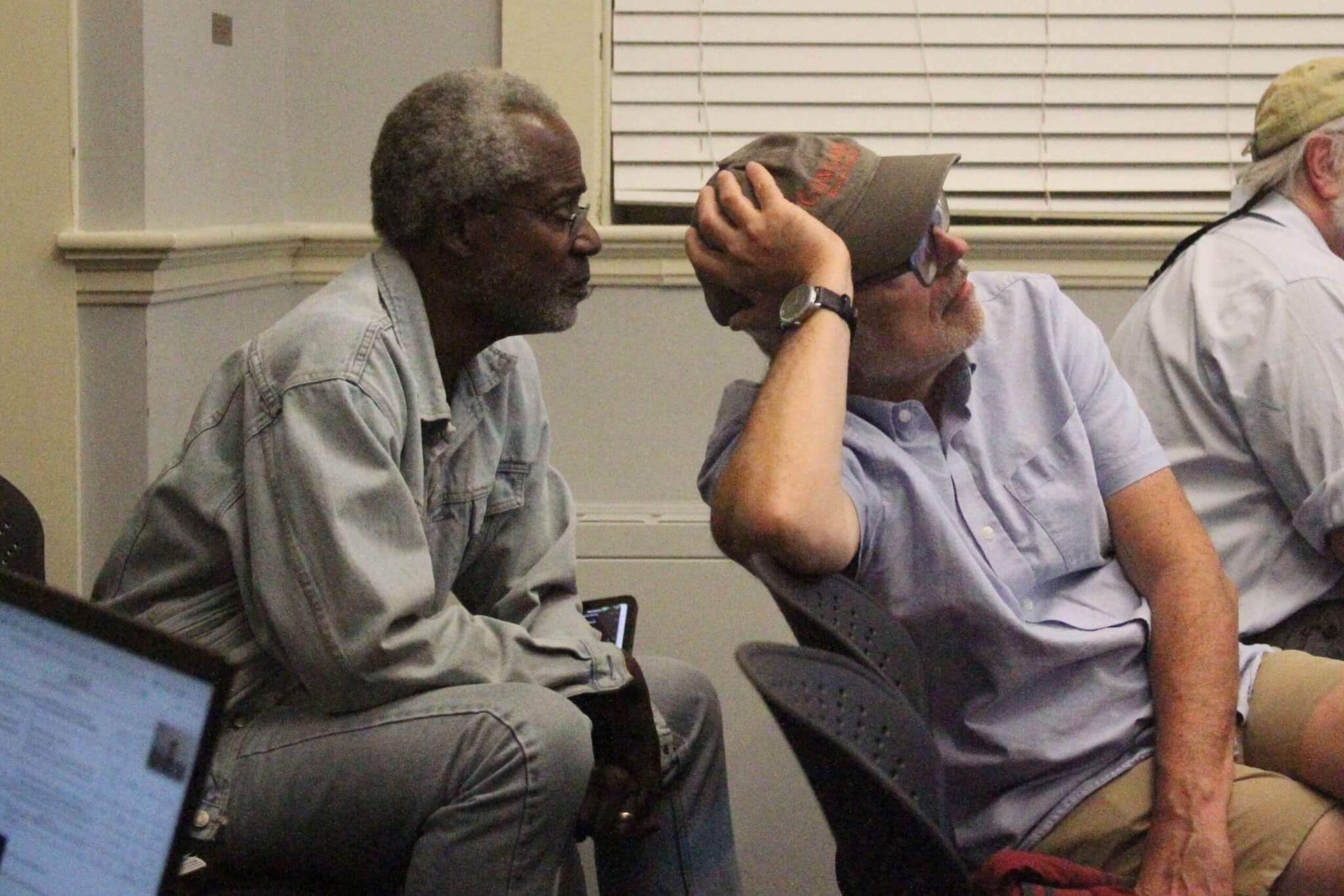 Black Heritage Trail Marker Advisory Team members Michael Williams, left, and Joe Palumbo, center, listen during the Select Board’s August 31 meeting. Photo: Dakota Antelman/The Acton Bridge