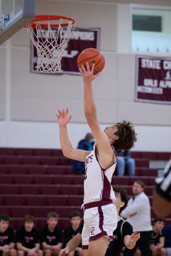 Lucas Lundberg elevates to the basket for a one-handed shot. Photo by Jon Straggas