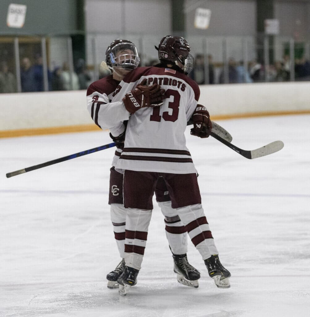 Late in the second period, Chris Bono (No. 3) celebrates with Tommy McKenna (No. 13) after McKenna’s goal extended CC’s lead to 2-0 over Lexington. Photo by Hugh Finnerty