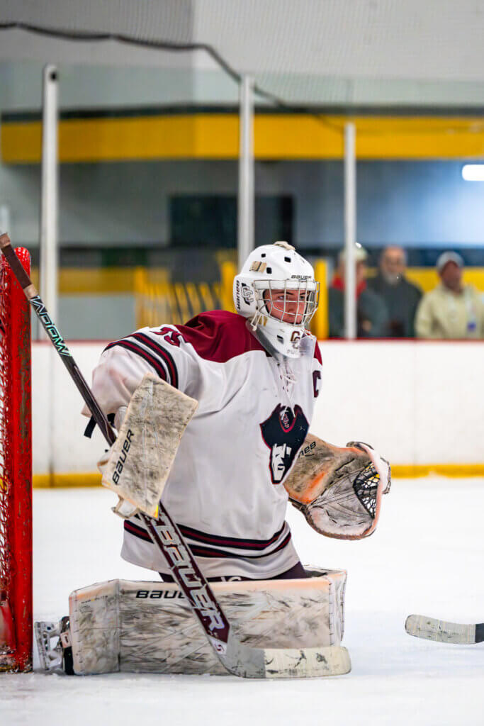 Acton-Carlisle goaltender Sam Griswold keeps his eye on the puck during a home game against Tewksbury on January 10. Photo by Aidan Moroney