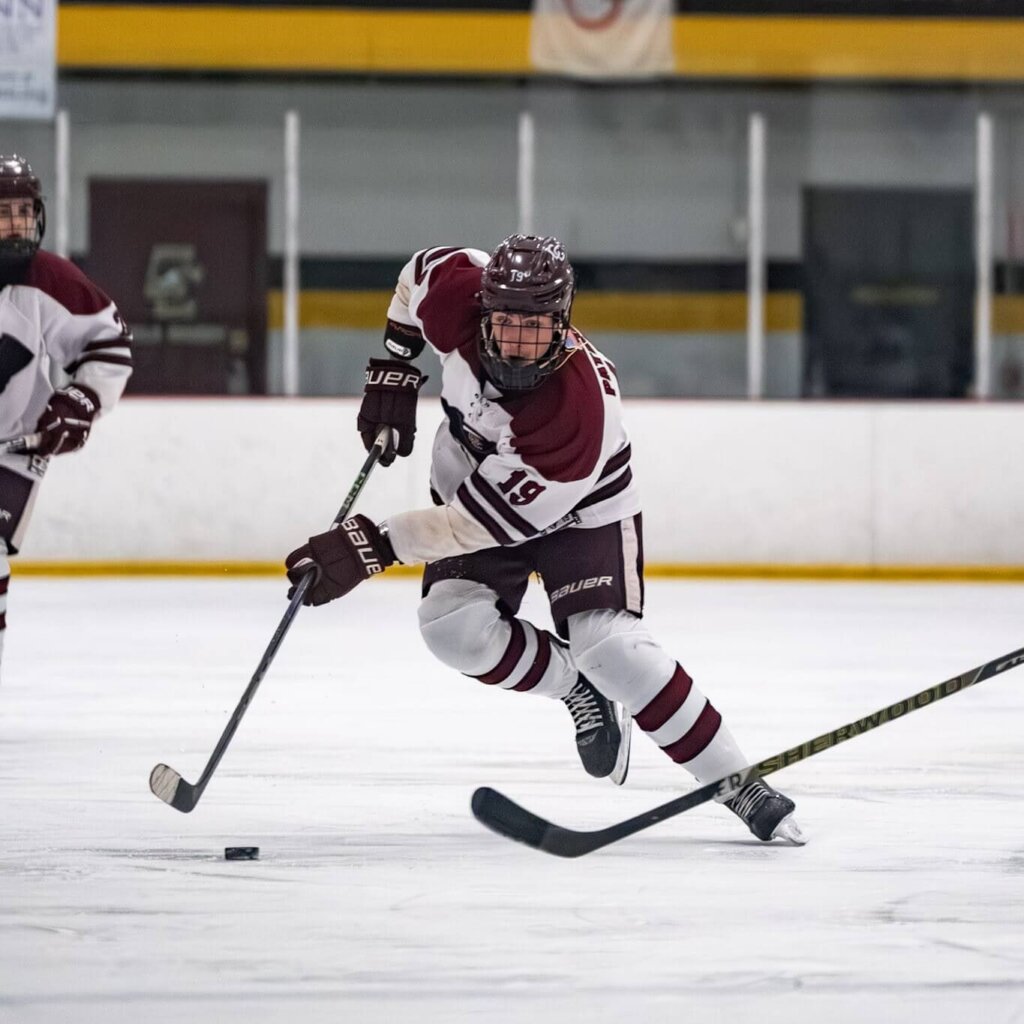 Taking the puck end to end, Will Steffens scored the game-tying goal and shifted the game momentum to the Patriots’ favor against Boston Latin in a comeback win on February 14. Photo by Aidan Moroney