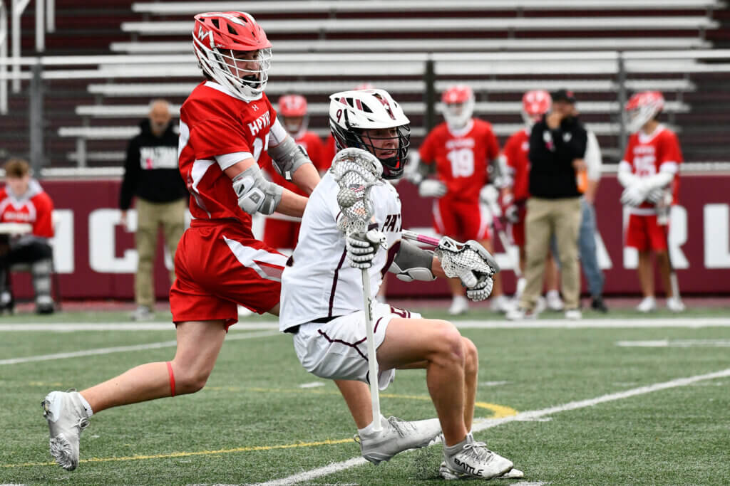 CCHS’ Peter Burke (No. 9) carries the ball against Waltham on April 30. Photo by Cris Van Dyke