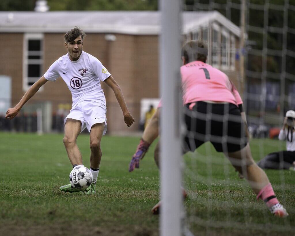 Max Hepworth (18) scores early in the first half against Bedford on September 16. Photo by Jon Straggas