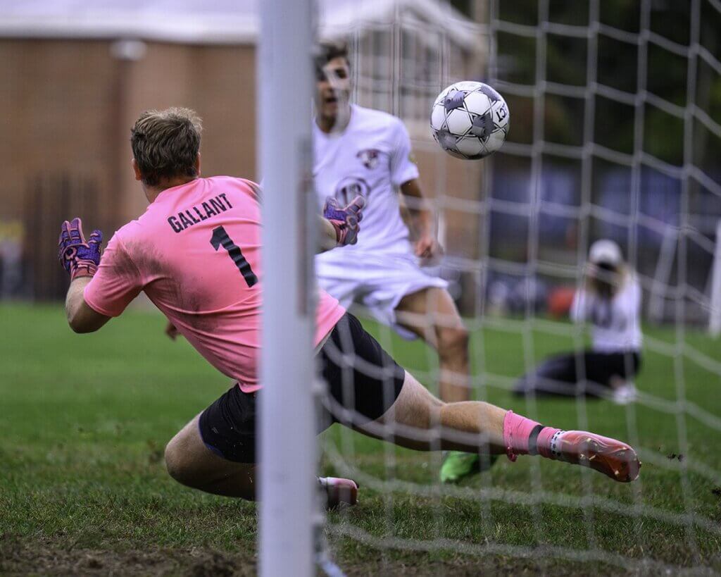 Max Hepworth (18) scores early in the first half against Bedford on September 16. Photo by Jon Straggas