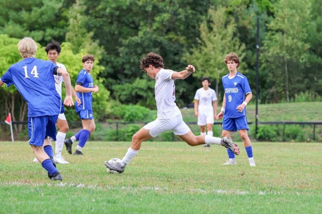 Mikey Jantzen puts a charge into the ball. He would convert a penalty kick to extend the CCHS lead. Photo by Janel Apuna