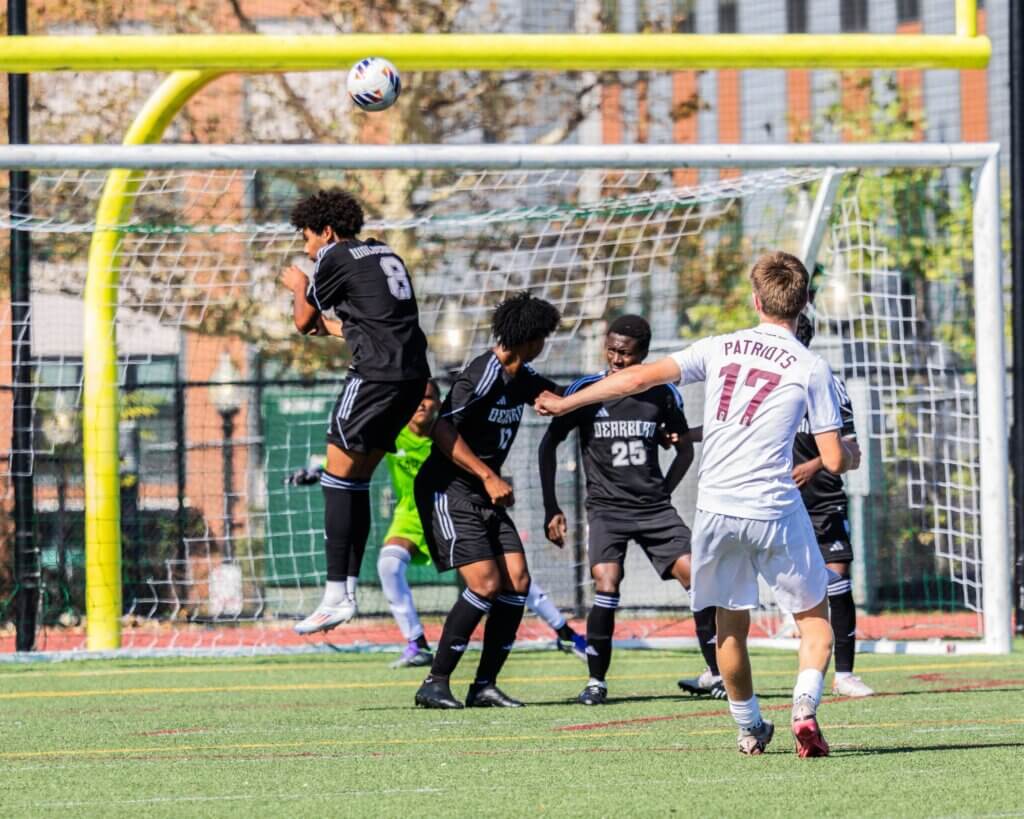 Donovan Eaton fires a free kick against Dearborn STEM Academy. Photo by Rebecca Woodward