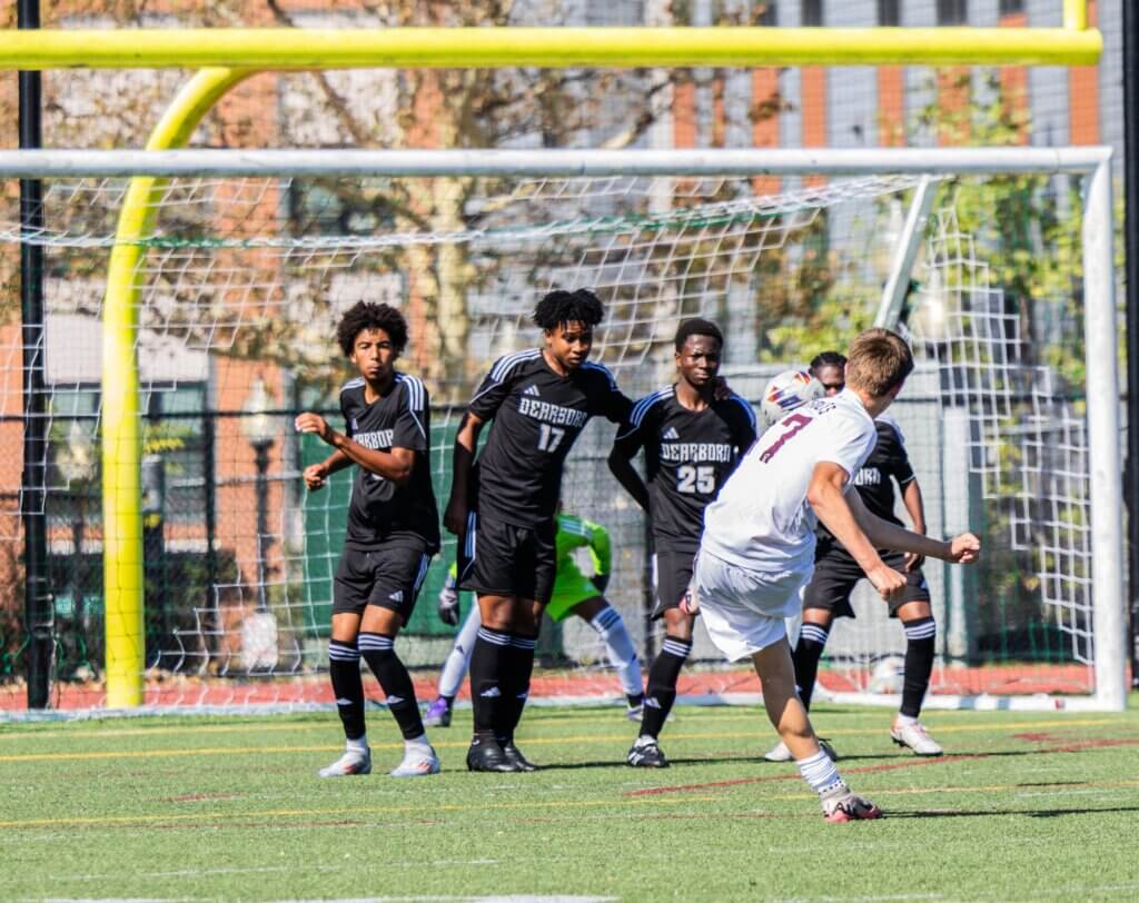 Donovan Eaton watches his free kick stream into the goal. Photo by Rebecca Woodward