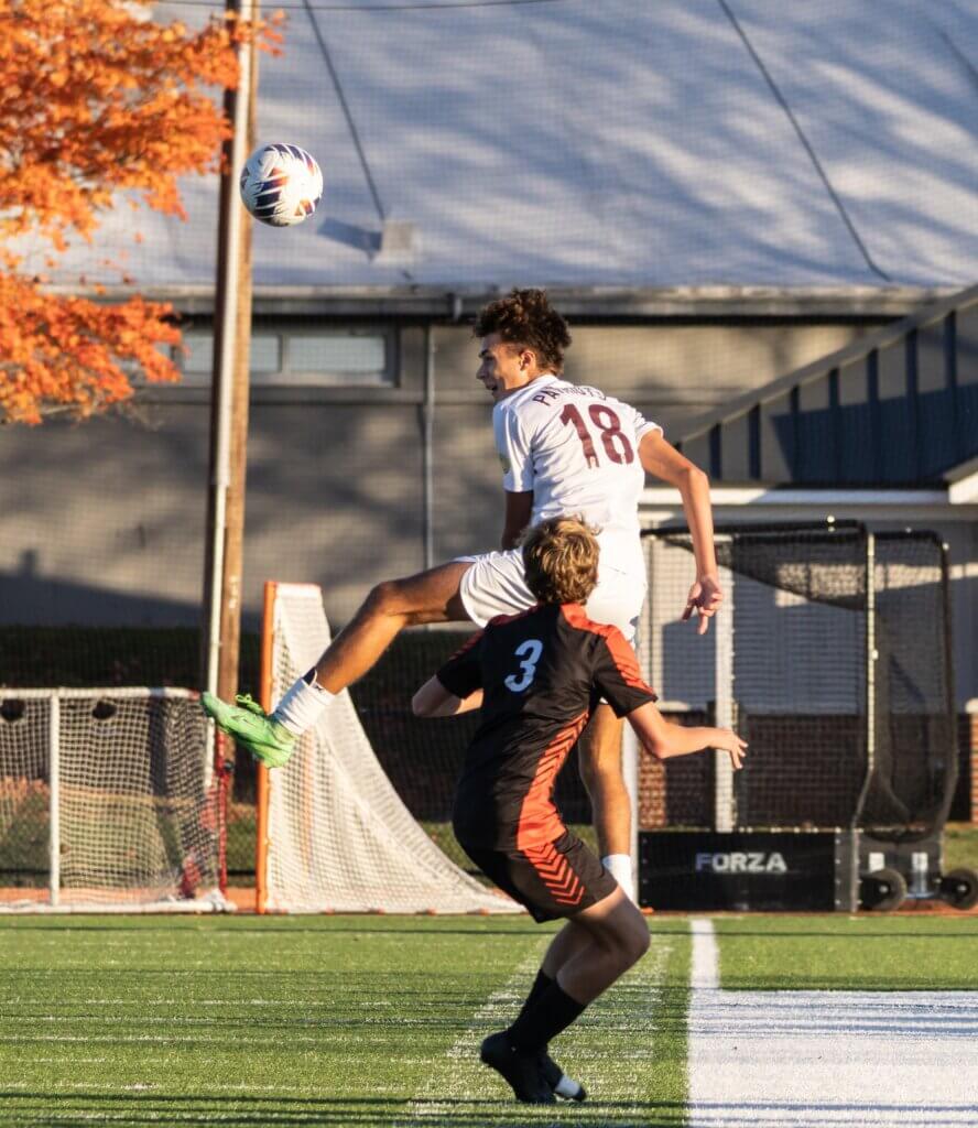 Max Hepworth elevates in the Pats’ 1-0 win over Wayland on October 21. Photo by Rebecca Woodward