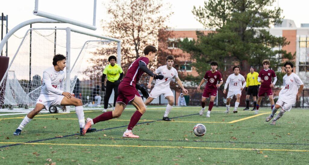Cal Van der Swaagh looks for an opening against Catholic Memorial in the Patriots’ 2-0 win on November 4. Photo by Rebecca Woodward