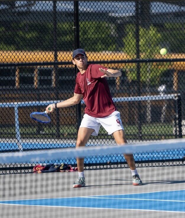 CCHS’ Pedro Nachbin readies for a forehand against Winchester. Photo by Alexis Guinebertiere
