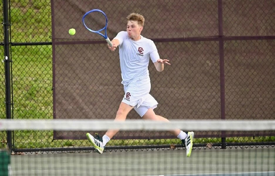 Acton-Carlisle’s Charlie Derkazarian fires a forehand return at second singles on May 28 versus Hopkinton. Photo by Alexis Guinebertiere