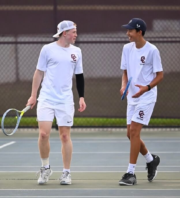 CCHS’ Jack Garofalo, left, and Austin Fischl confer during their second doubles match against Hopkinton on May 28. Photo by Alexis Guinebertiere