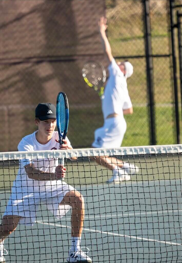 Acton-Carlisle doubles partners Jack McClellan and Brooks Miller play a point against Lincoln-Sudbury on April 27. Photo by Alexis Guinebertiere