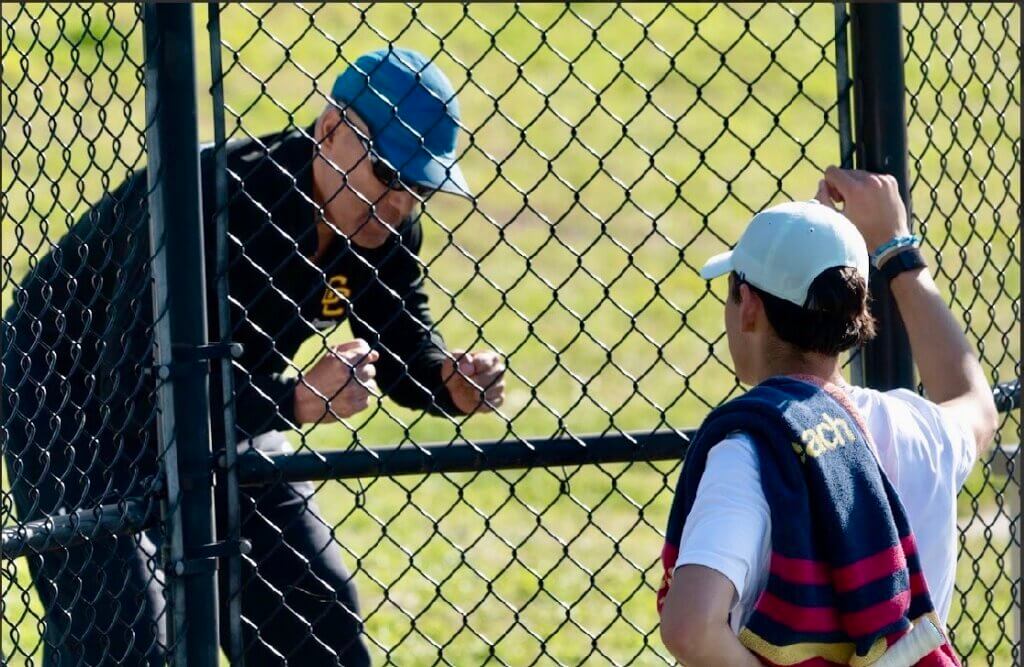 Acton-Carlisle Coach Marcus Lewis fires up Pedro Nachbin, who had his first loss of the season against Westford on May 12. Nachbin regrouped the next day to defeat his opponent from Acton-Boxborough. Photo by Alexis Guinebertiere