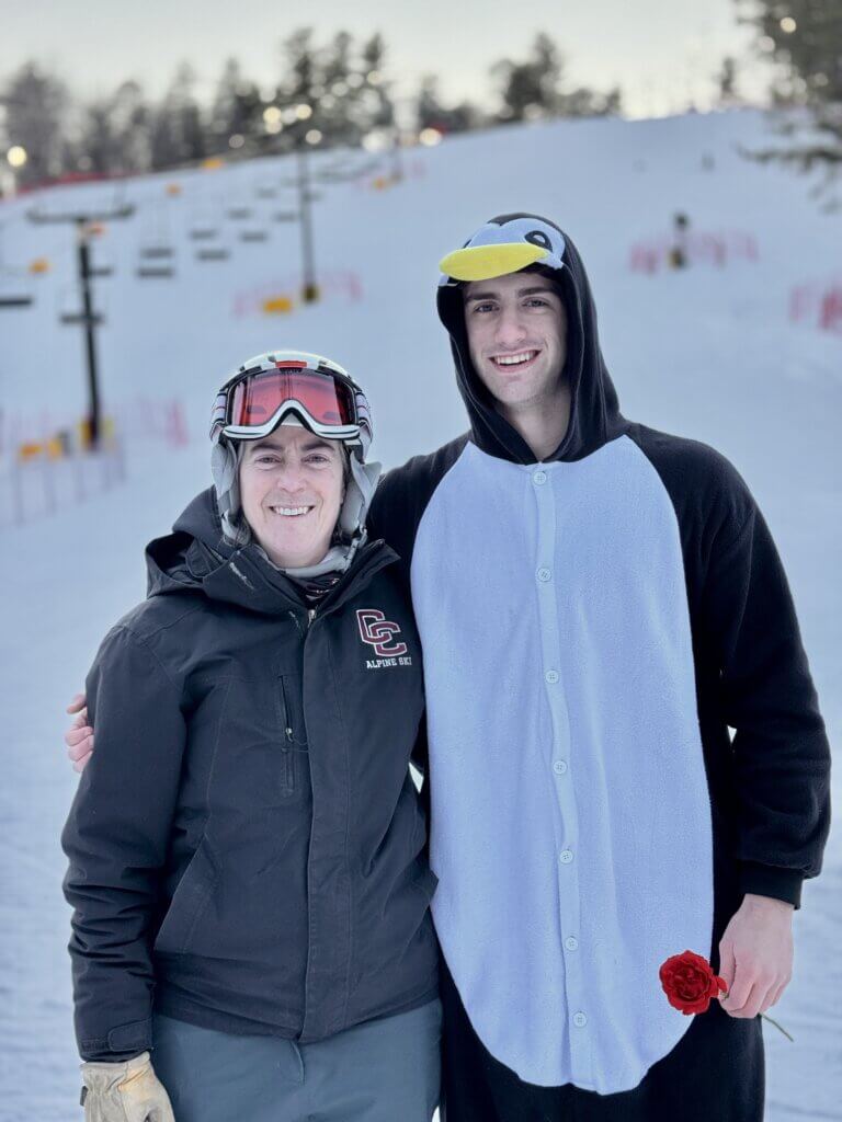 Head Coach Amy Brooks with co-captain Theo Remington, who won the race and placed first overall in the Omega League. Photo by Doug Remington