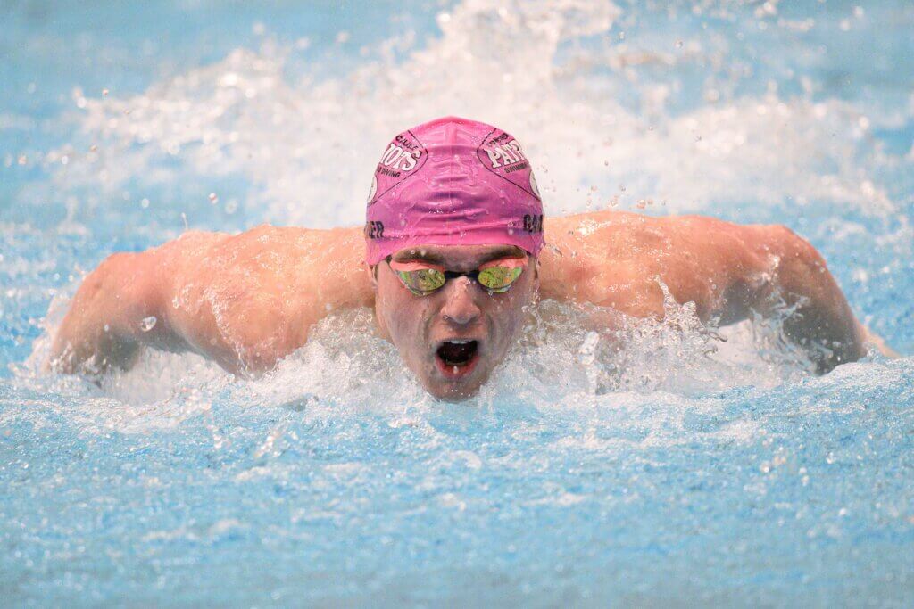 Charlie Gamber swims the 100 butterfly at the MIAA Division 1 Championships last Sunday. Photo by Jon Straggas