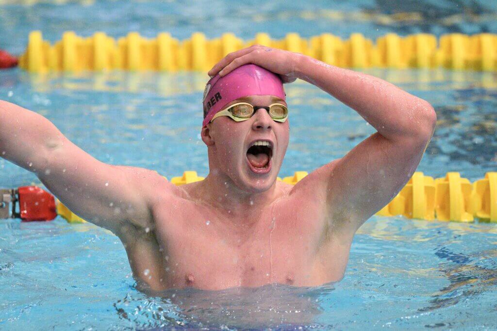 Harry Gamber celebrates after the 500 freestyle at the MIAA Division 1 Championships last Sunday. Photo by Jon Straggas