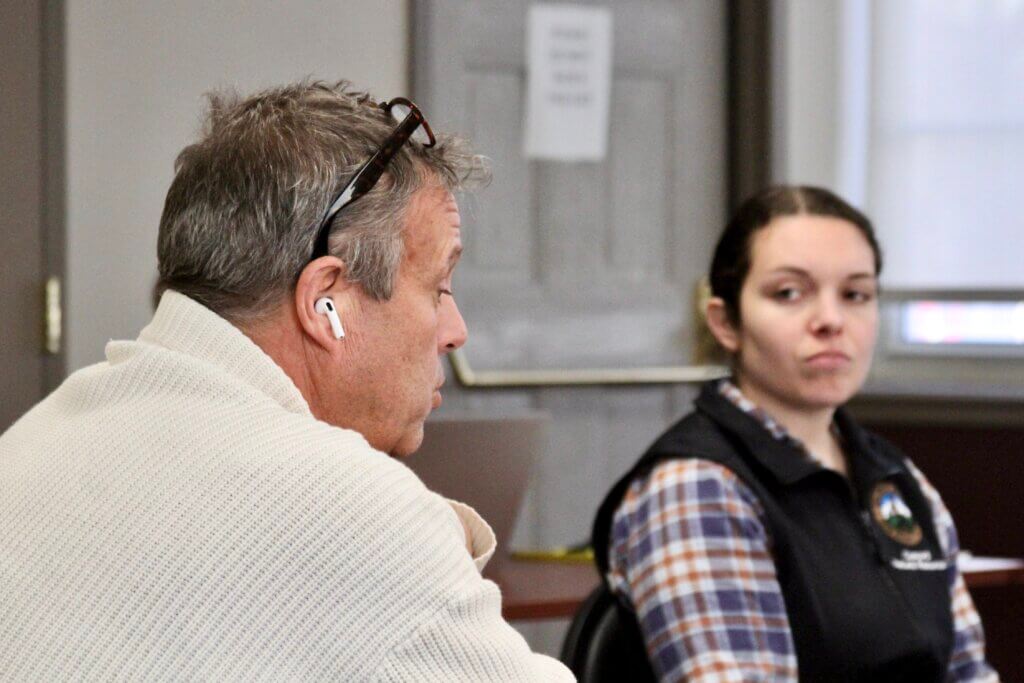 Miguel Echavarri, left, one of 10 people suing the town over its handling of a contractor’s dirt piles near the Acton rotary, addressed the Natural Resource Commission last year. Photo: Dakota Antelman/The Acton Bridge
