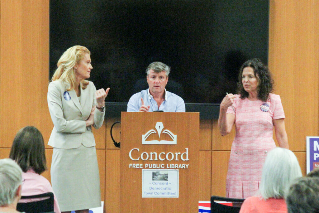 Governor’s Council incumbent Mara Dolan, left, and challenger Margie Palladino, right, jostle for time while Acton Democratic Town Committee Chair Matt Boger, center, moderates the exchange. Photo: Dakota Antelman/The Acton Bridge