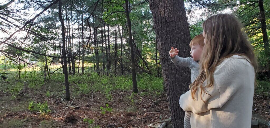 Kate Dauria holds her son Jack, 2, as he waves goodbye to the departing interlopers. Courtesy photo