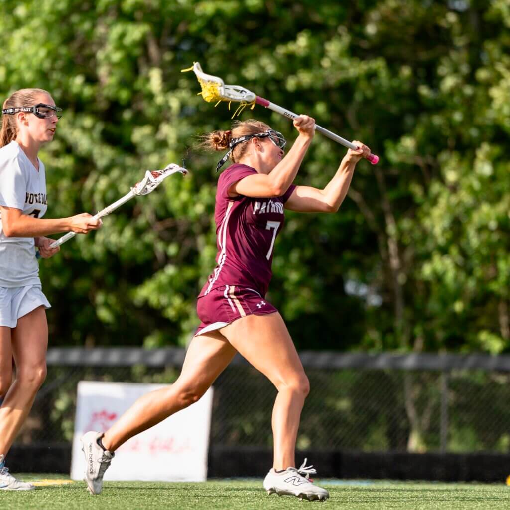 CCHS co-captain Sarah Fortier on her way to firing the winning goal in sudden death overtime to give the Patriots their second straight MIAA Division 1 title. Photo by Aidan Moroney