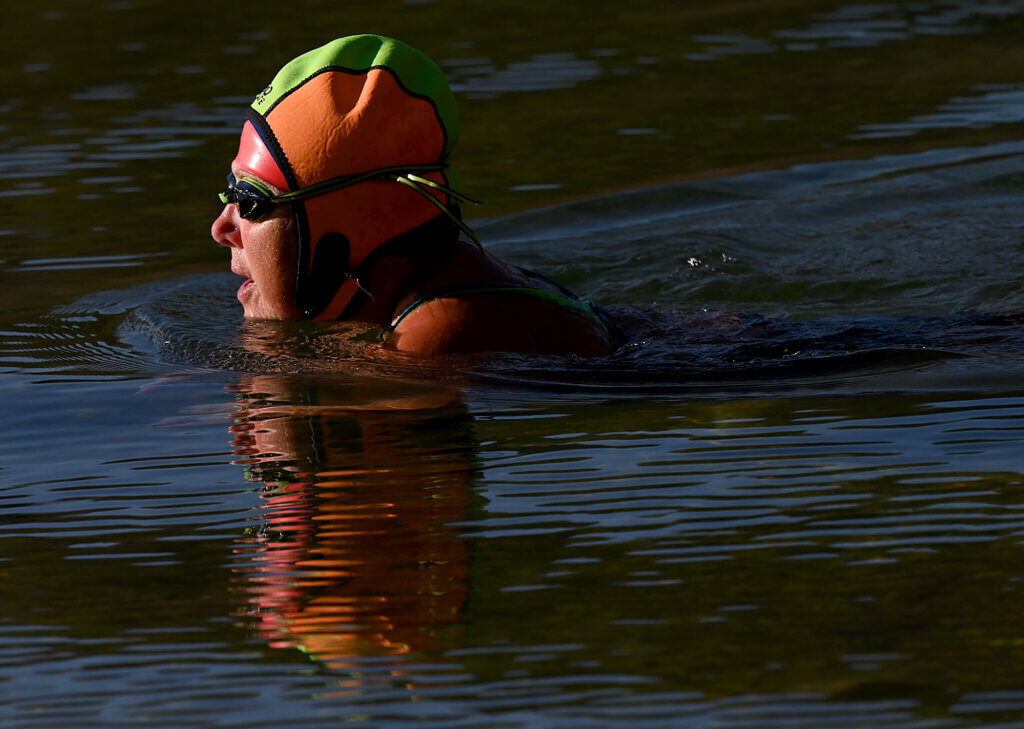 Erzsebet “Bogie” Bognar, 68, swims across Walden Pond in November. Photo: Ken McGagh/The Acton Bridge