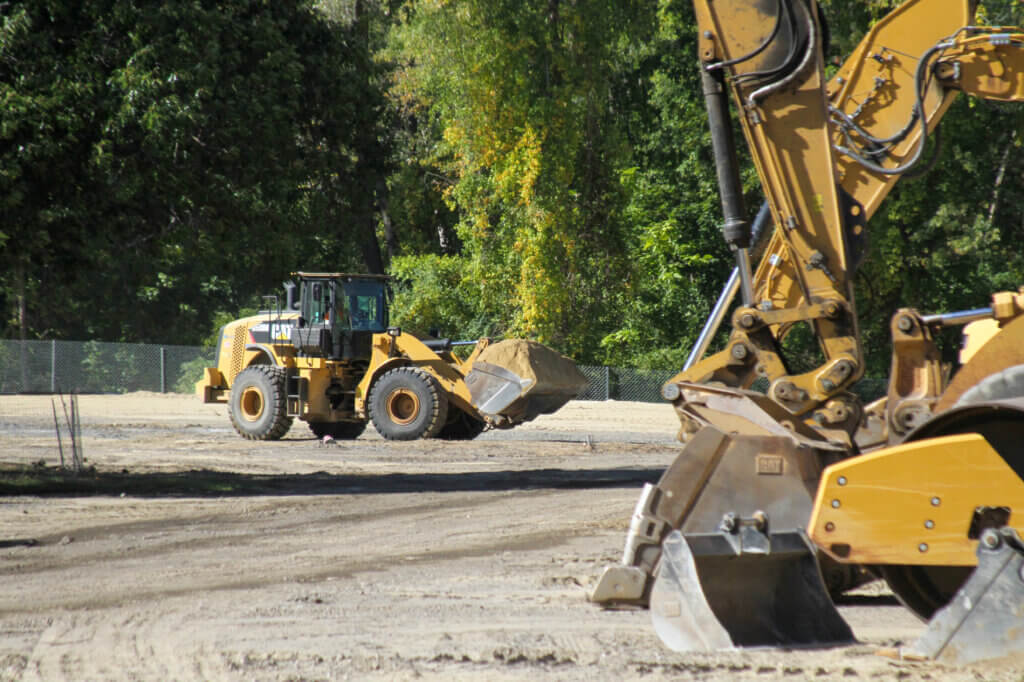 Crews remained hard at work while developers and town officials marked the start of Novo construction. Photo: Dakota Antelman/The Acton Bridge