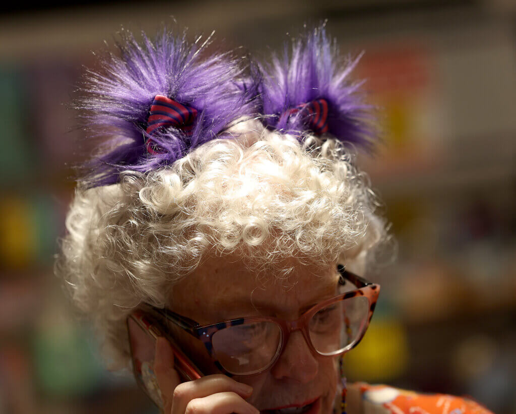 Marie Foley, owner of Revolutionary Acton with her tademark colorful headgear on Saturday, September 6, 2025 Ken McGagh/The Acton Bridge
